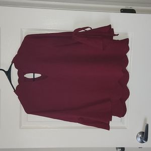 Red shirt with high neck and flared arms